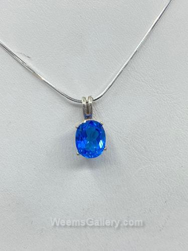 Ice bleu topaz pendant by Suzanne Woodworth